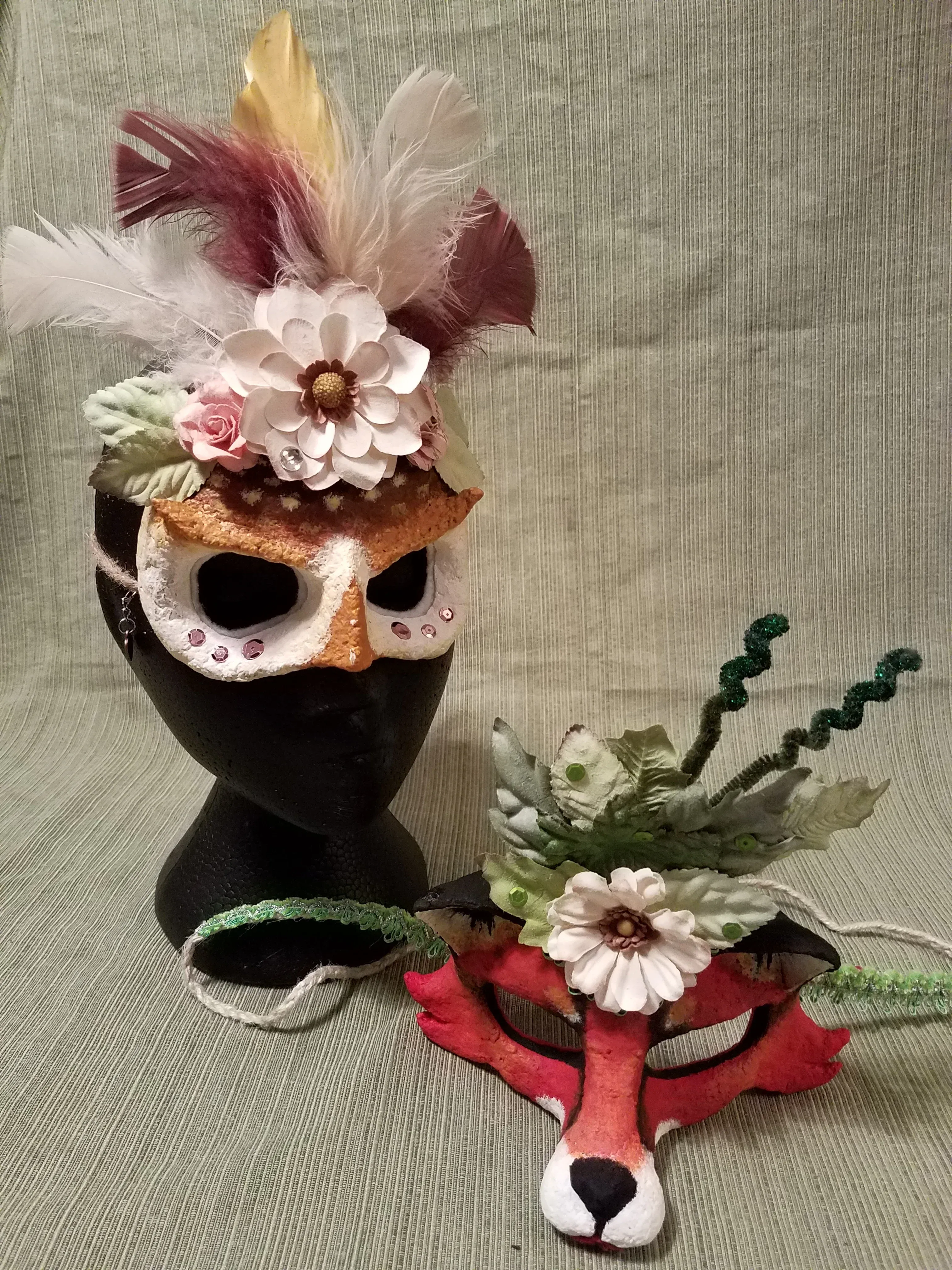 Handmade paper craft masks with colorful designs